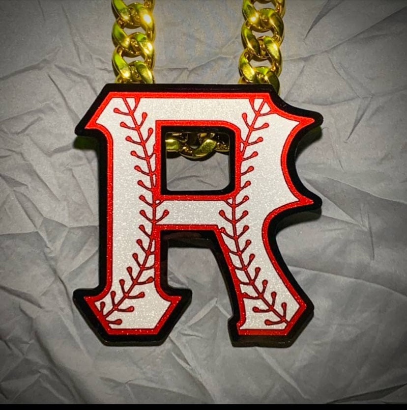 Red letter R baseball pendant on a gold chain